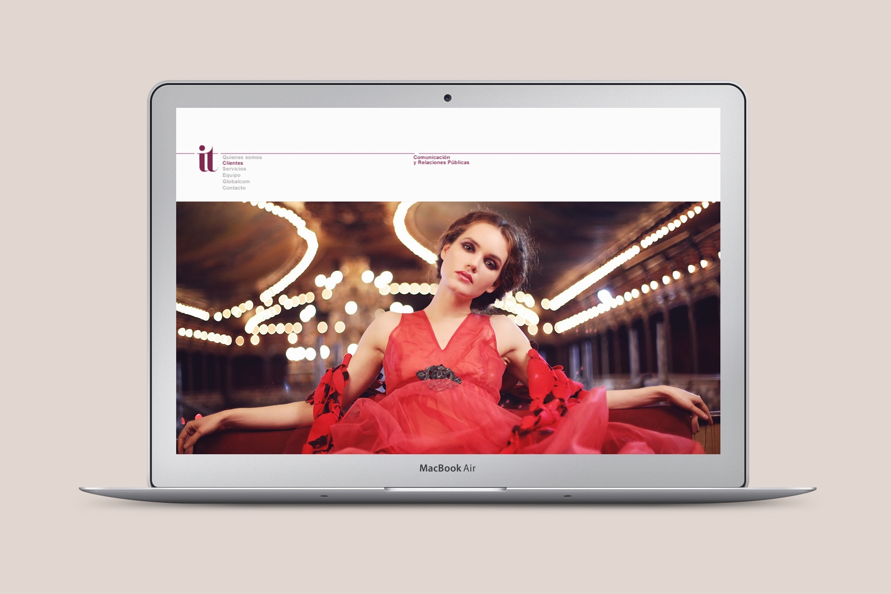 Homepage design&nbsp; of the IT COMMUNICATION website. Includes a female model wearing&nbsp; a sexy red dress. Website designed by Esiete branding and communication studio and programmed by sevenap.